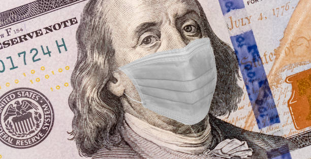 istock Benjamin Franklin With Worried and Concerned Expression Wearing Medical White  Face Mask On One Hundred Dollar Bill 1218142803
