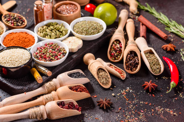 istock Pepper, salt, paprika, basil and other on a dark background 1218144769
