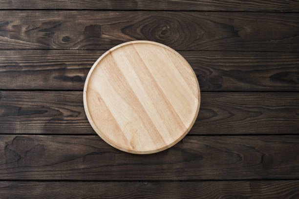 istock wooden dishes on  old wooden table 1218144976