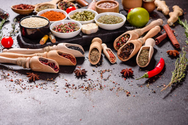 istock Pepper, salt, paprika, basil and other on a dark background 1218145008