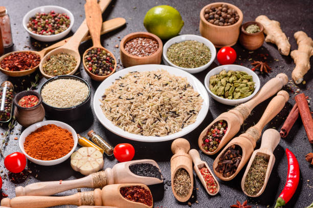 istock Pepper, salt, paprika, basil and other on a dark background 1218145010