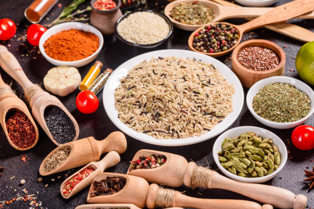 istock Pepper, salt, paprika, basil and other on a dark background 1218145078