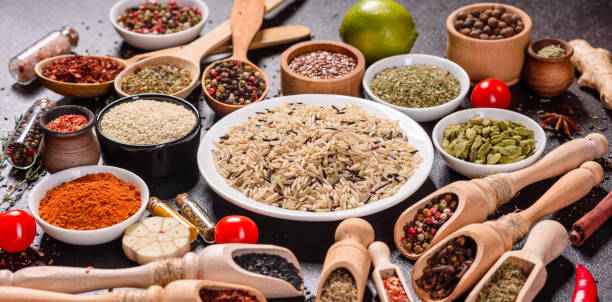 istock Pepper, salt, paprika, basil and other on a dark background 1218145092