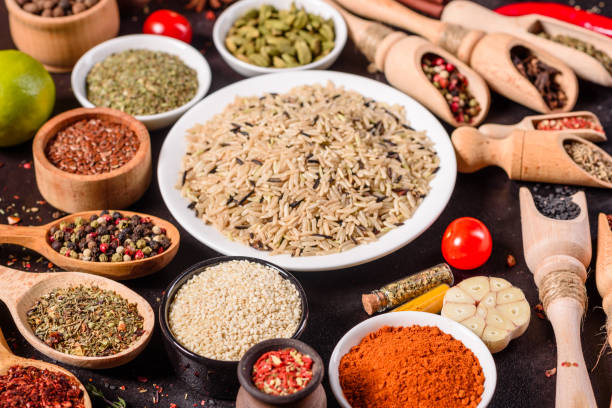 istock Pepper, salt, paprika, basil and other on a dark background 1218145125
