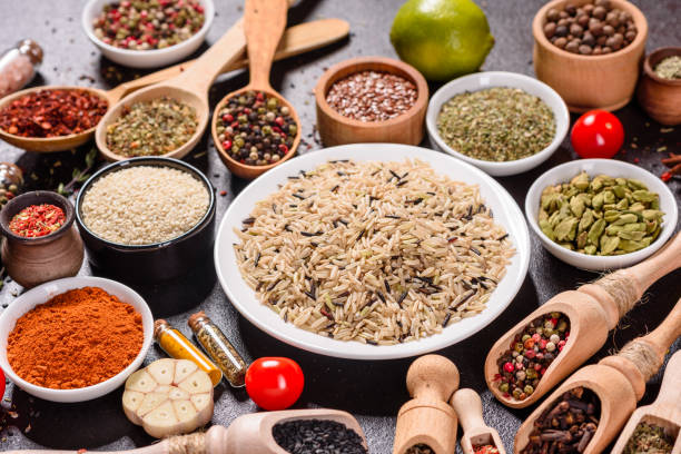 istock Pepper, salt, paprika, basil and other on a dark background 1218145128