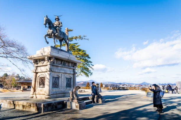 Date Masamune monument riding on a horse located in Ruin of the old Sendai Aoba castle. stock photo