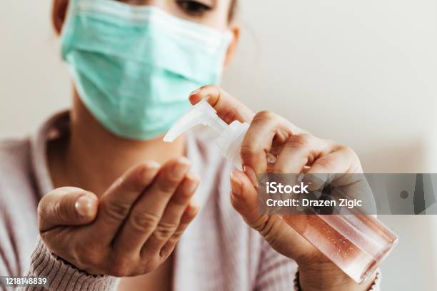 Closeup Of Woman Cleaning Her Hands With Antiseptic Hand Gel Stock Photo - Download Image Now