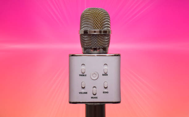 istock Wireless Bluetooth Microphone with karaoke isolated on jazzy background 1218150842