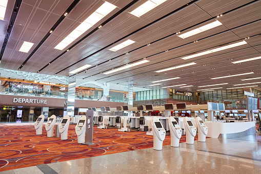 Changi Airport, Singapore - April 4th, 2020: Due to the covid-19 pandemic, travel ban enforced in Singapore prevents citizens from traveling abroad thus the empty auto check in machines untouched.