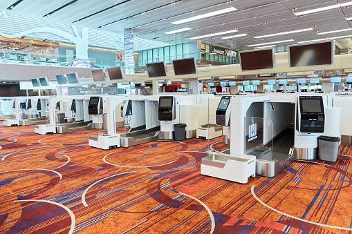 Changi Airport, Singapore - April 4th, 2020: The auto check in baggage system is to help improve the speed of checking in travellers baggage without the need of more manpower, unfortunately due to the COVID-19 and travel ban in Singapore, it is left unused for a period of time.