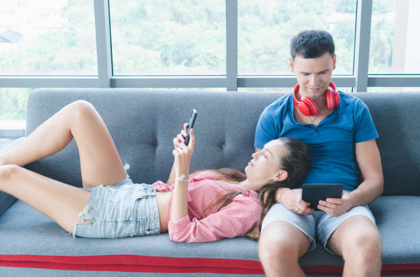 istock Husband and wife doing hobbies at home 1218161079
