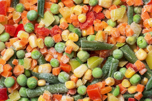 istock Chopped frozen vegetables background. Corn peas pepper carrots 1218161244
