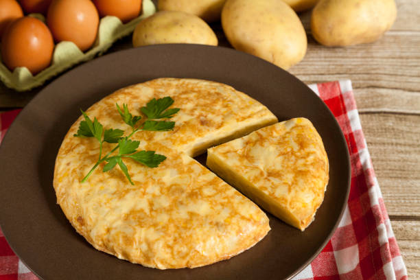 istock Spanish omelette and portion on wood 1218163946