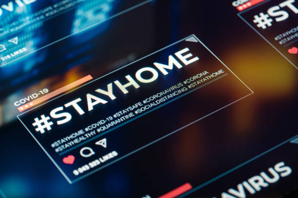 istock #stayhome. Stay home hashtag close-up on digital display 1218165372