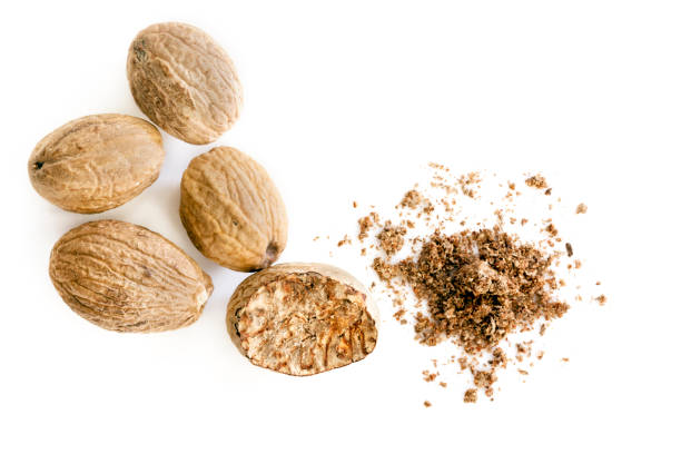 istock Nutmeg Whole and Ground Top View Isolated 1218166274