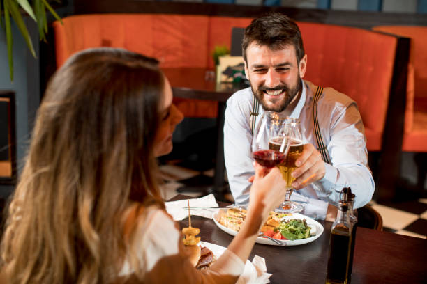 istock Beautiful loving couple is spending time together in modern restaurant 1218168023