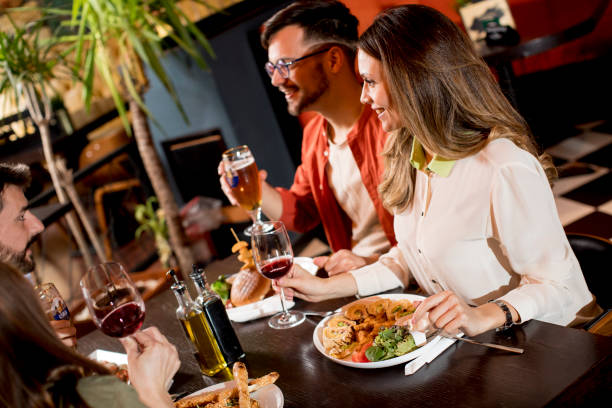 istock Young people having dinner in the restaurant 1218168038