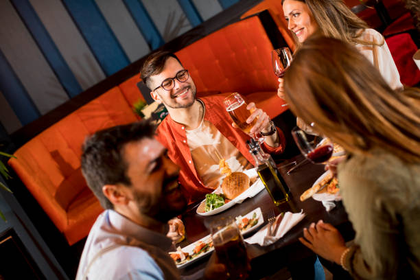 istock Young people having dinner in the restaurant 1218168048