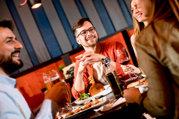istock Young people having dinner in the restaurant 1218168049