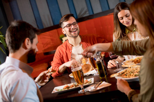 istock Young people having dinner in the restaurant 1218168052