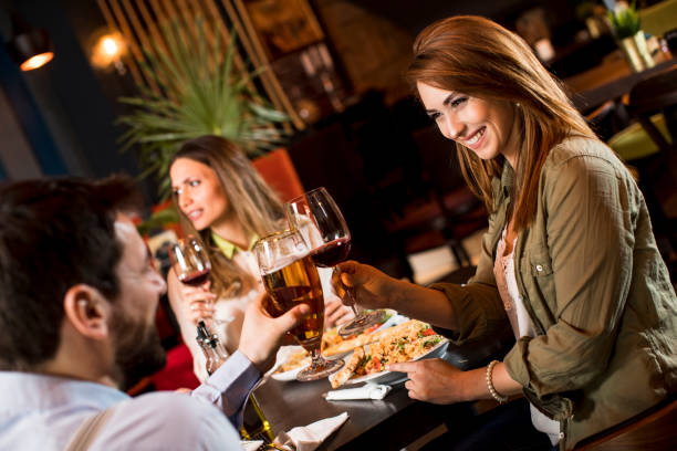 istock Young people having dinner in the restaurant 1218168053
