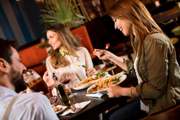 istock Young people having dinner in the restaurant 1218168055