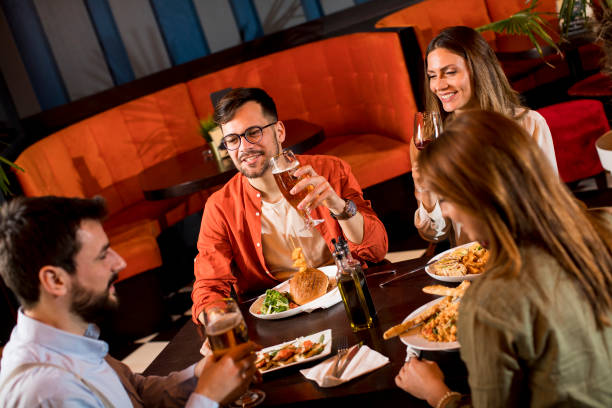 istock Young people having dinner in the restaurant 1218168061