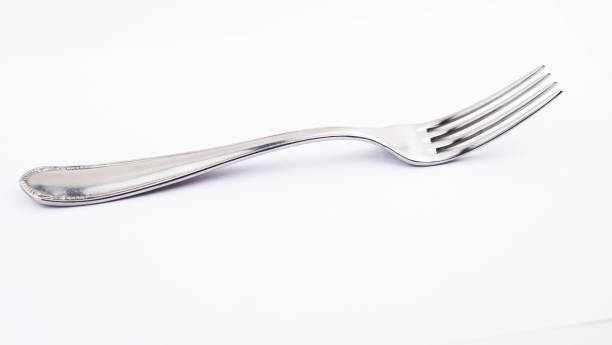 istock fork isolated on white background. metal fork. vintage fork cutlery side view 1218168890