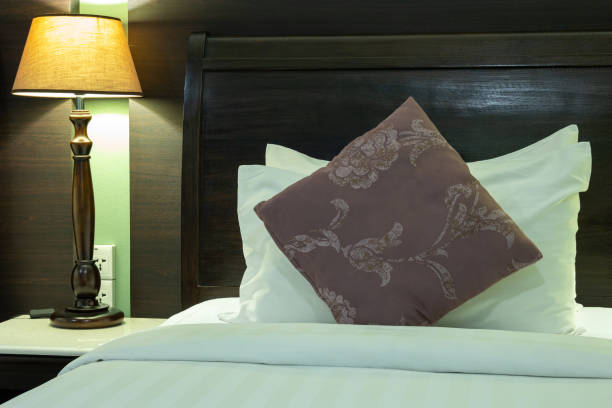 istock Bedroom Interior with Pillow and Table Lamp 1218169420