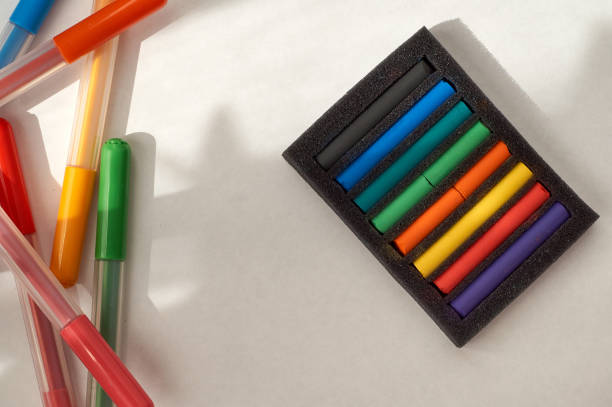 istock drawing with pastels and felt pens. Multi-colored pastel pieces in a package and felt pens. 1218170467