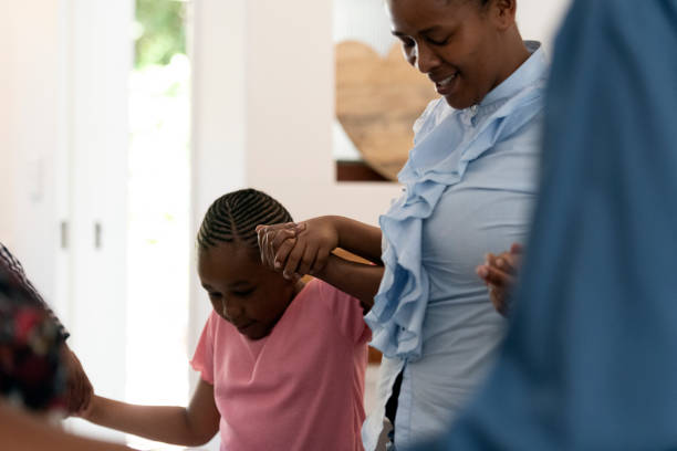 istock Mother saying grace holding daughters hand 1218171215