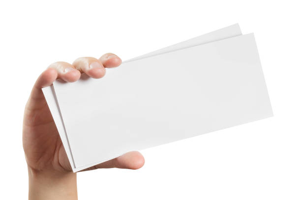 Two empty paper sheets in hand on white Two empty paper sheets in hand, isolated on white background coupon photos stock pictures, royalty-free photos & images
