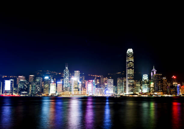 Victoria Harbor and Hong Kong with lights at night.