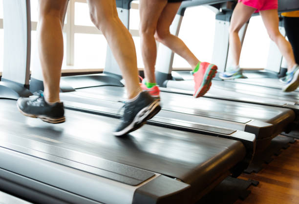 istock Unrecognizable people running on treadmills 1218175218