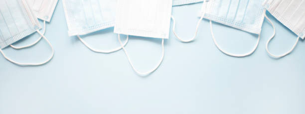istock Banner for the site with medical masks on a light blue background. 1218176562