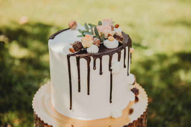 young woman holding birthday wedding cake
