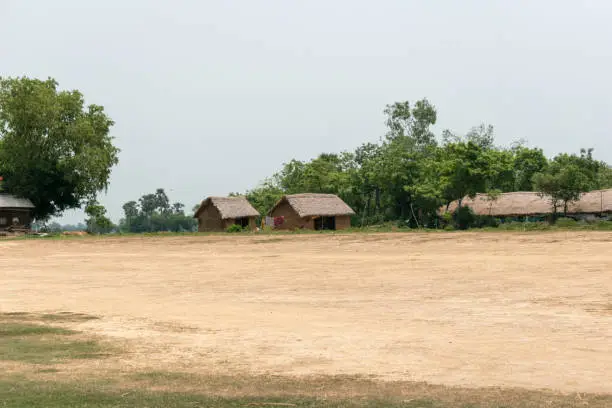 Picture of a small village inhabited by tribals in West Bengal of India. Poor villagers live in those huts which made of bamboo and clay