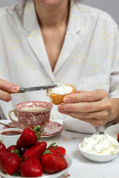 istock Unrecognizable woman having breakfast in pajamas at home in quarantine 1218178676