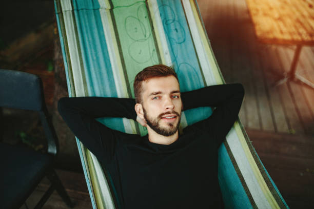 istock Young man Relaxing in a hammock 1218179054