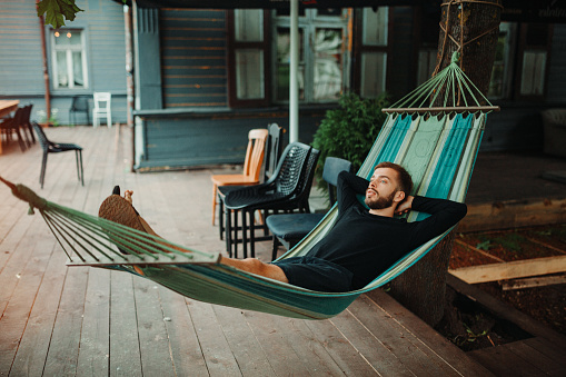 Young man Relaxing in a hammock
