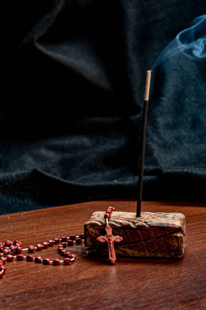 istock Incense stick lit with a third beside it for moments of reflection, devotion and faith 1218179914