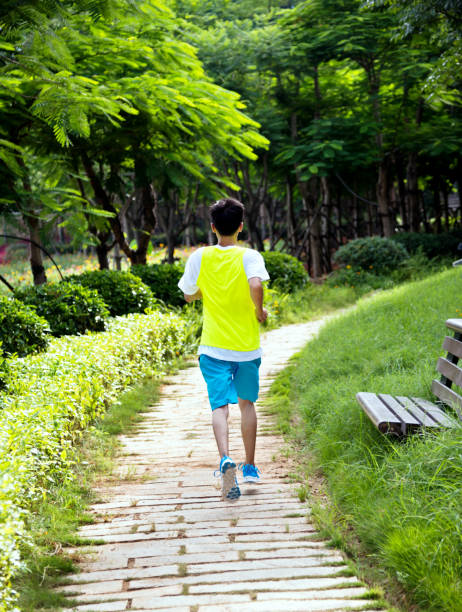 istock Young man running cross country at summer 1218179926