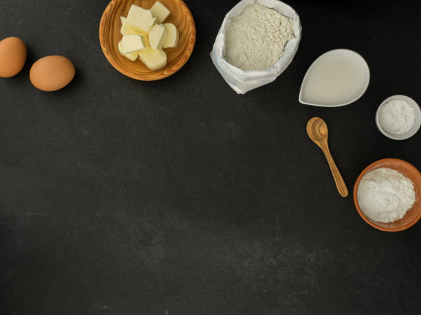 istock eggs, butter, milk, sugar, baking powder and flour on slate background 1218181815