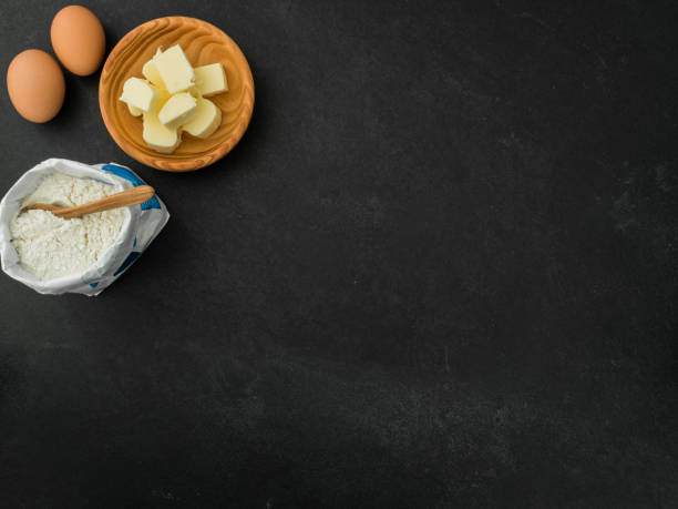 istock eggs, butter and flour on slate background 1218181826