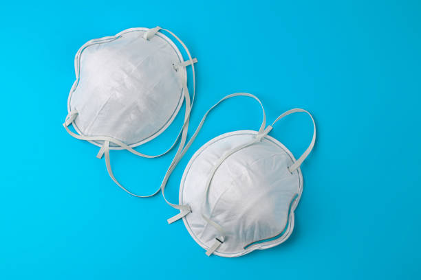 istock White medical mask isolation. Protective face mask against pollution, viruses, flu and coronavirus. Health care and surgical concept. 1218184849