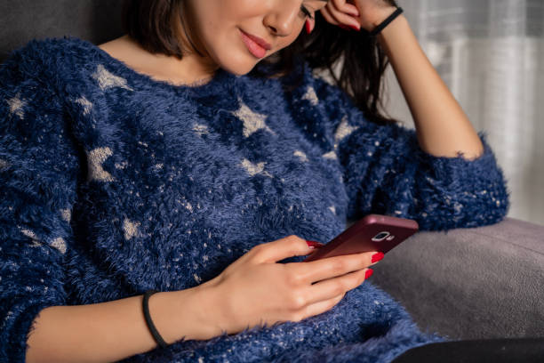istock Young woman is using phone 1218185479