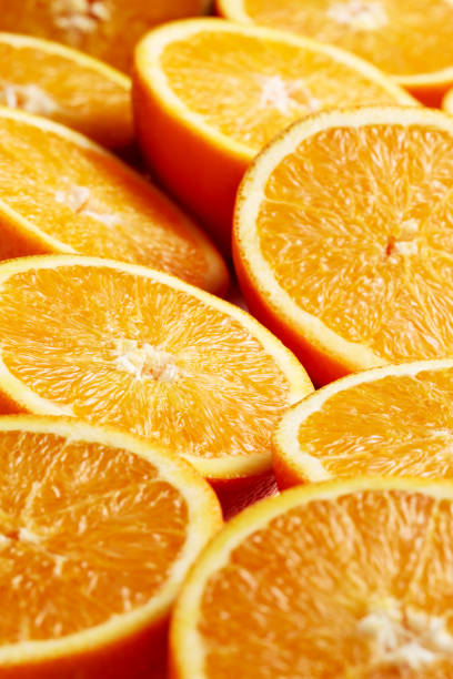 istock Heap of fresh halved orange slices 1218185546