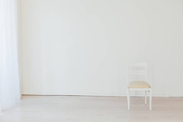 istock one old vintage chair in an empty white room 1218185833