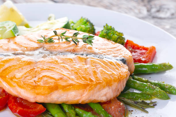 istock Grilled salmon steak butterfly with vegetables 1218188678
