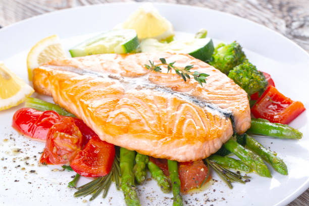 istock Grilled salmon steak butterfly with vegetables 1218188696